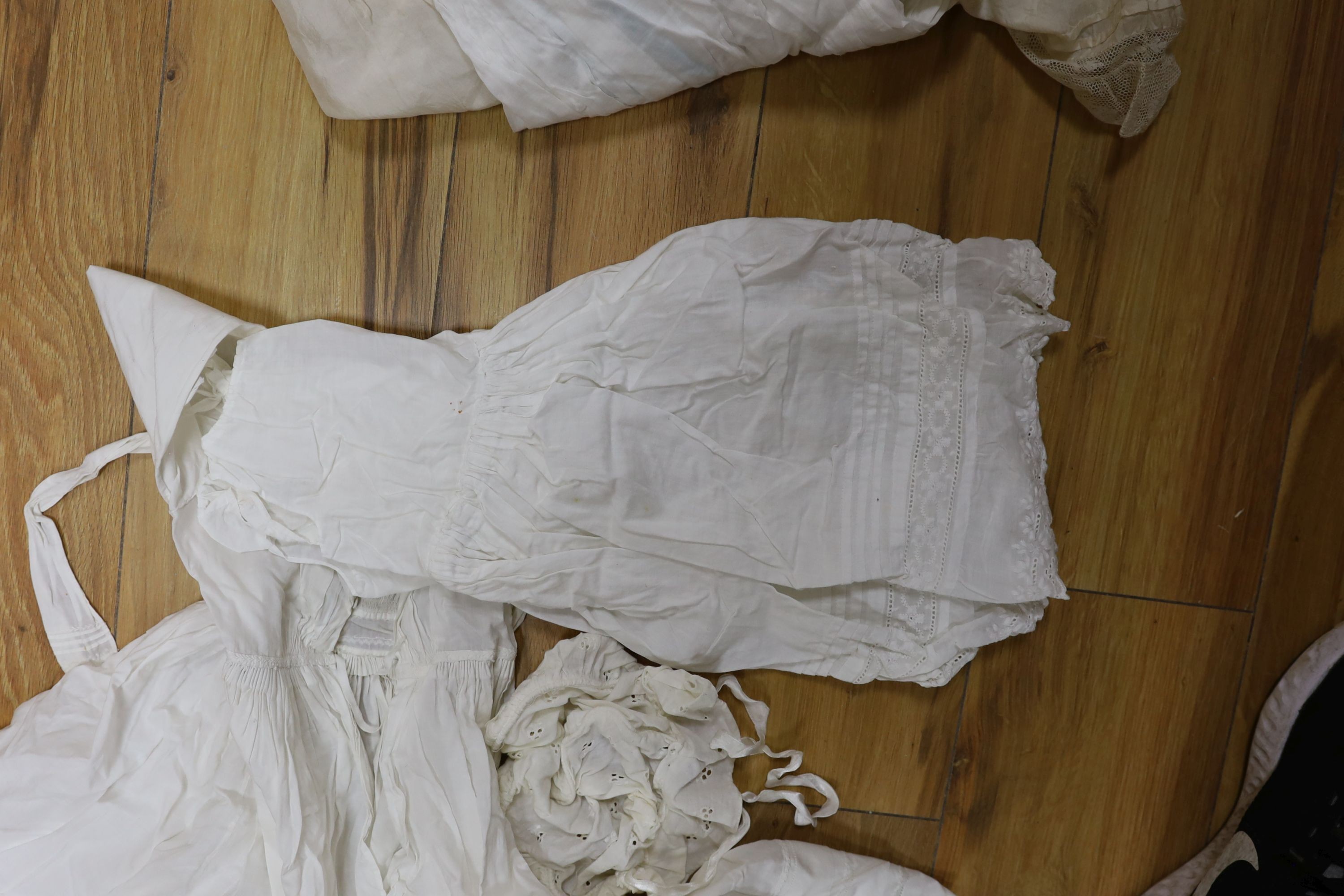 A collection of whiteworked baby gowns